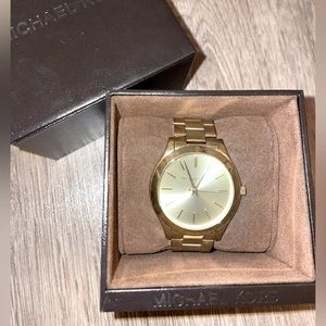 Gold sleek face Michael Kors watch